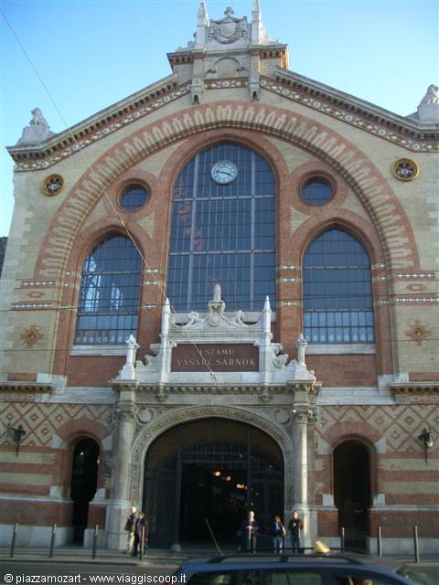 Brick and ceramic facade of Budapest's Great Market Hall with central clock