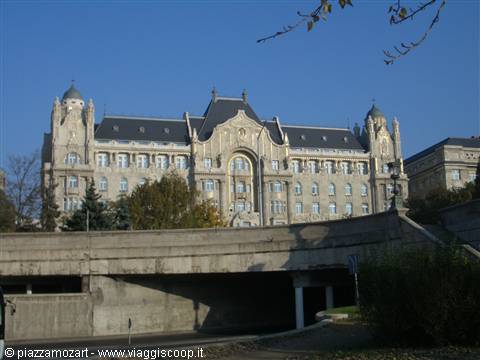 Gresham Palace in Budapest above a concrete overpass, morning light