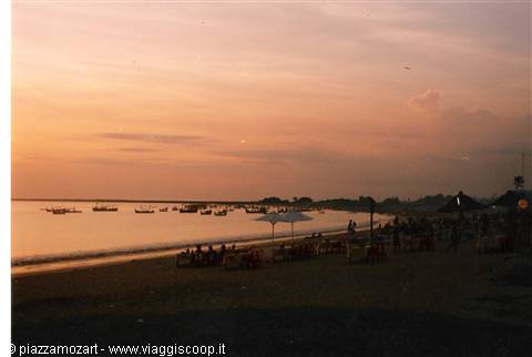 Fishing boats and beach umbrellas at Lovina at dusk