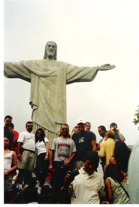 Tourists beneath Christ the Redeemer statue, Rio de Janeiro, misty light