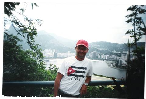 Man wearing CUBA shirt and red cap by the bay, Rio de Janeiro