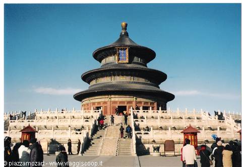 Temple of Heaven in Beijing, tourists climbing the marble steps under a blue sky