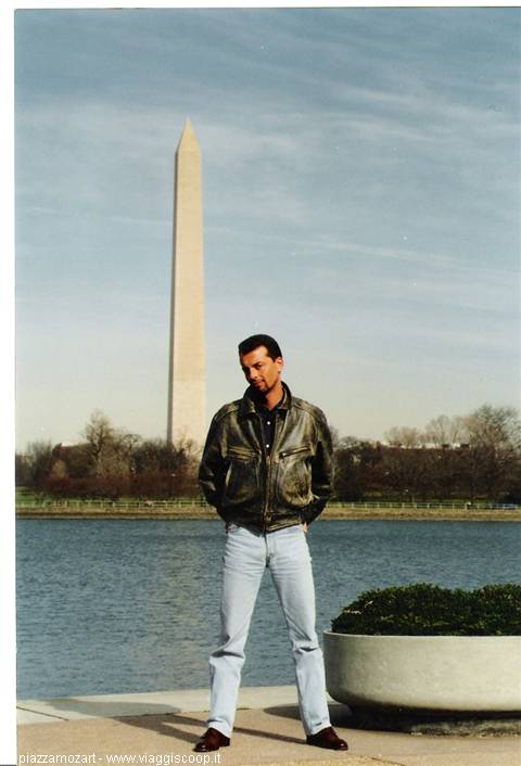 Man in leather jacket in front of the Washington Monument and tidal basin