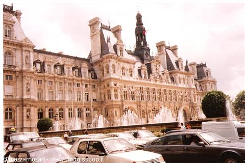 Paris Hôtel de Ville, ornate stone facade with fountains and parked cars