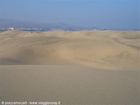 Maspalomas sand dunes with the distant town on the horizon
