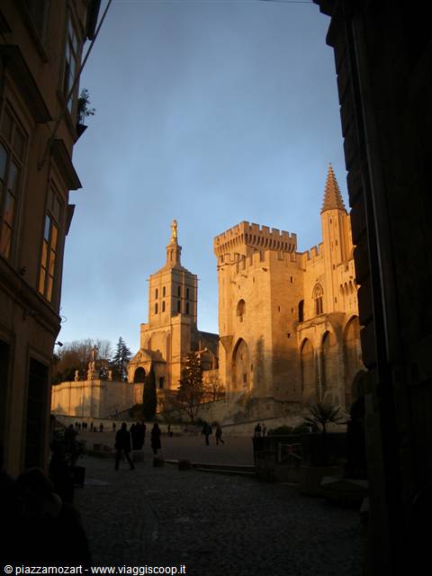 The Popes' Palace in Avignon lit by evening sunlight