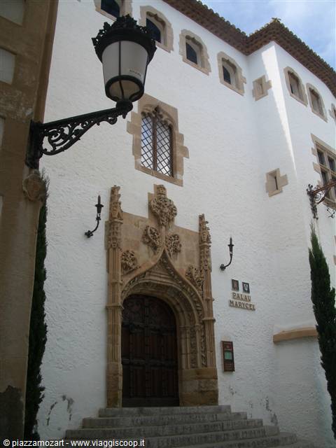 Gothic stone portal of Palau Maricel in Sitges, with wrought iron lantern
