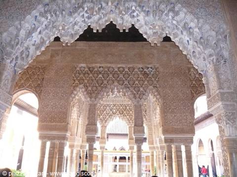 Intricately carved stucco arches of the Alhambra in Granada, soft daylight