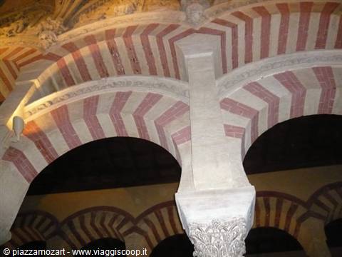 Two-tone stone and brick arches inside the Mezquita of Córdoba