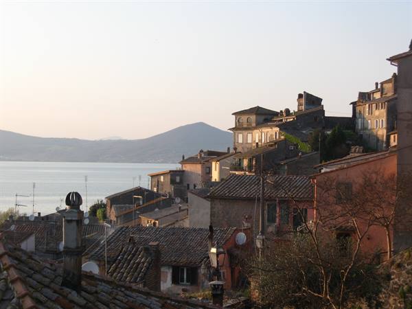 Terracotta rooftops of Anguillara Sabazia on Lake Bracciano, golden light