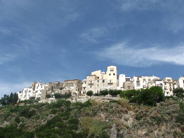 Sperlonga, white houses perched on the rock under a blue sky
