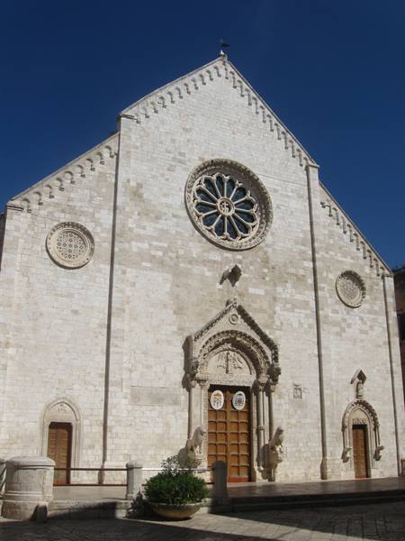 Romanesque facade of the Basilica of San Nicola in Bari, stone and rose window
