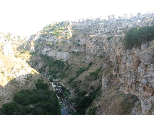 Sassi di Matera stone dwellings carved above the ravine in morning light