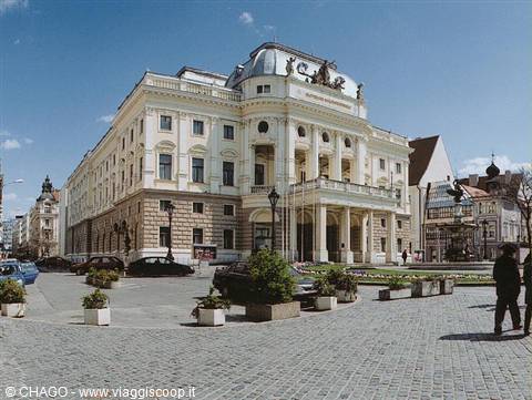Bratislava National Theatre, white neorenaissance facade, cobbled square with planters
