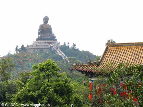 Big bronze Buddha at Ngong Ping above a golden temple roof
