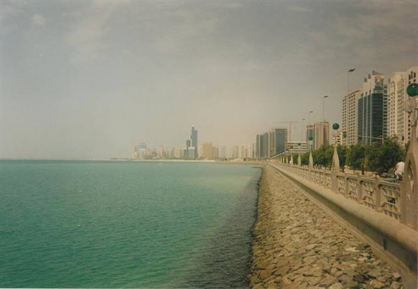 Abu Dhabi Corniche waterfront with skyscrapers and turquoise sea