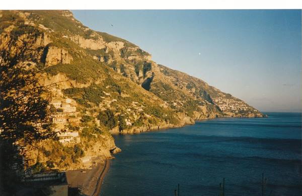 Colorful houses on Positano cliffs above the blue sea