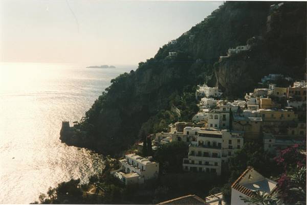 Positano's white houses tumble down the cliff, glowing sea and Li Galli islands afar