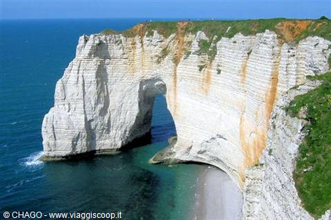 White chalk cliff with natural arch over the sea at Étretat