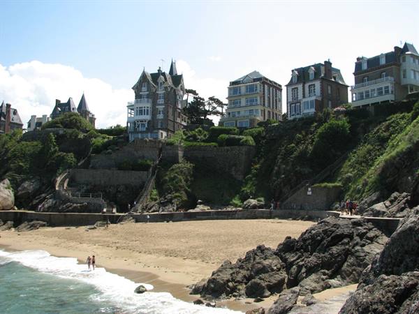 Historic villas on the cliff above a small sandy beach, Dinard