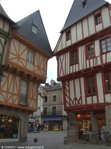 Half-timbered houses in Vannes, orange and red facades over a pedestrian square