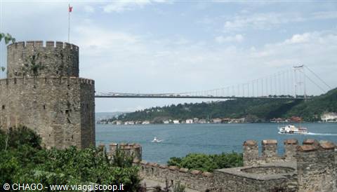 Stone towers of Rumeli Hisarı on the Bosphorus, suspension bridge and ferry