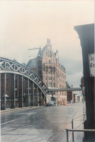 Steel bridge in front of red brick warehouses, Speicherstadt Hamburg