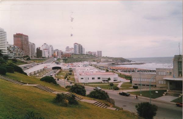 Mar del Plata: buildings along the coast, beach umbrellas, cloudy sky