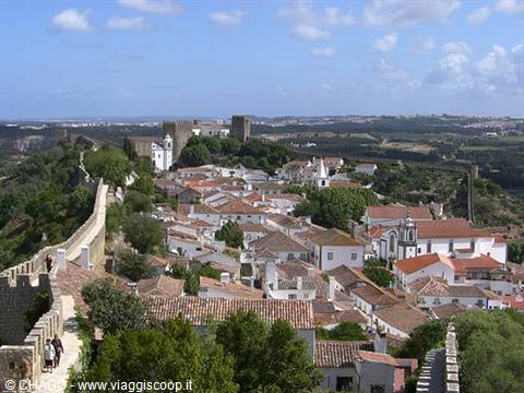 Óbidos medieval walls surround whitewashed houses with red roofs