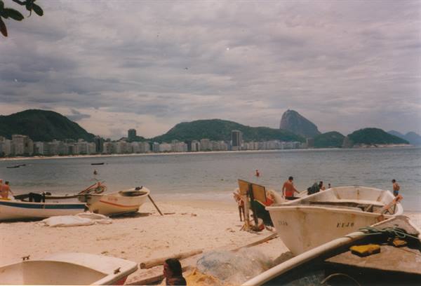 Fishing boats on Copacabana beach with Sugarloaf Mountain in the background