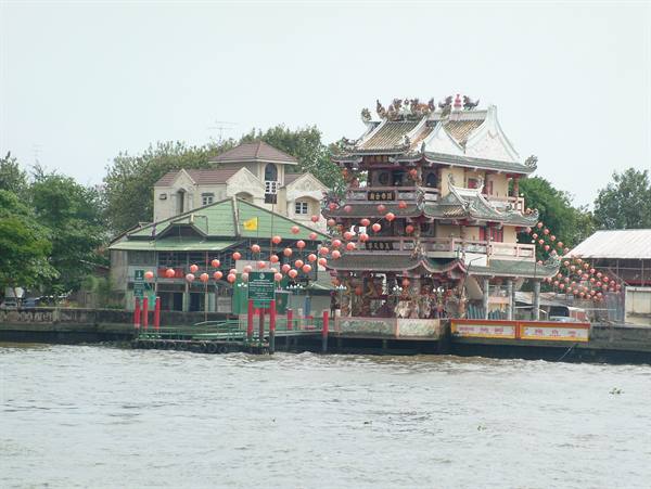 Chinese temple with red lanterns along the Chao Phraya river