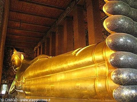 at the feet of the reclining Buddha