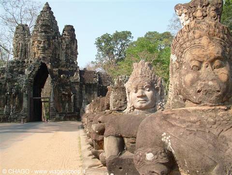 South gate of Angkor Thom lined with giant carved stone faces