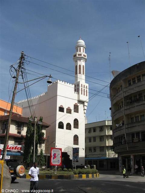 White mosque with minaret among Mombasa's downtown buildings