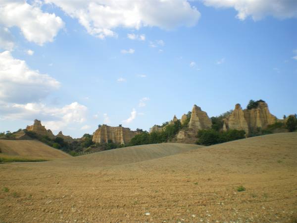 the Balze of Volterra, eroded clay hills under a cloudy sky