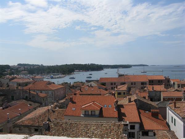 the medieval red roofs of the old town of Parenzo