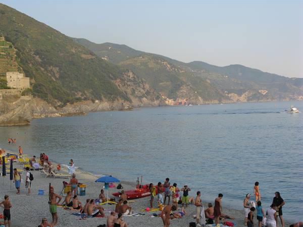 beach of Monterosso with a view of Vernazza, Corniglia and Manarola