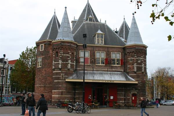 De Waag in Amsterdam, medieval brick gate tower with conical roofs