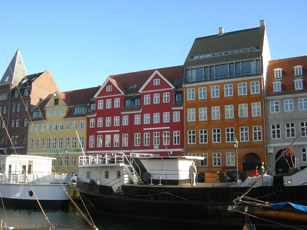 Nyhavn, Copenhagen: colorful row houses and moored boats along the quay