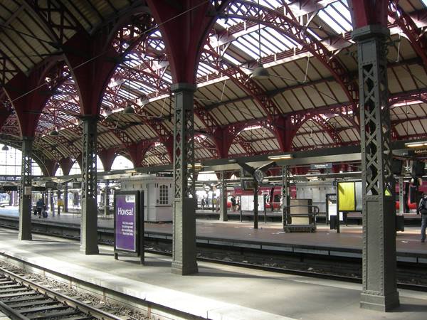 Tracks beneath the red steel roof of Copenhagen Central Station