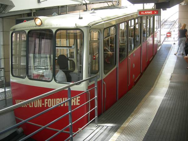 The red Vieux-Lyon-Fourvière funicular departing from the station