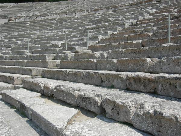 Limestone seating tiers of the ancient theater of Epidaurus in daylight