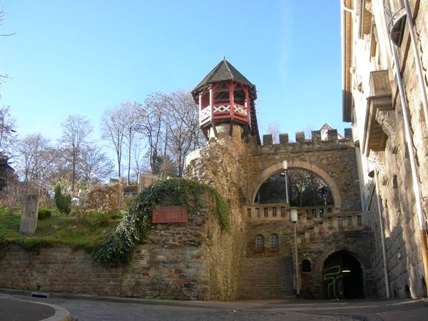 Red wooden turret atop stone walls, at Römertor in Wiesbaden