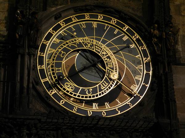 Prague astronomical clock, black and gold dial with zodiac rings and hands