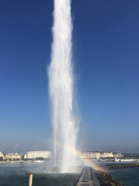 Geneva's Jet d'Eau shoots water skyward, rainbow over the pier