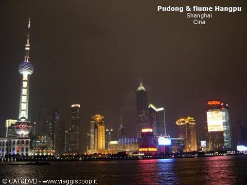 Oriental Pearl Tower and illuminated Pudong skyscrapers at night over the Huangpu River, Shanghai
