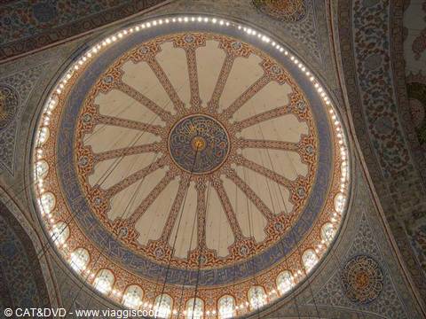 Decorated dome of the Blue Mosque in Istanbul with lit windows