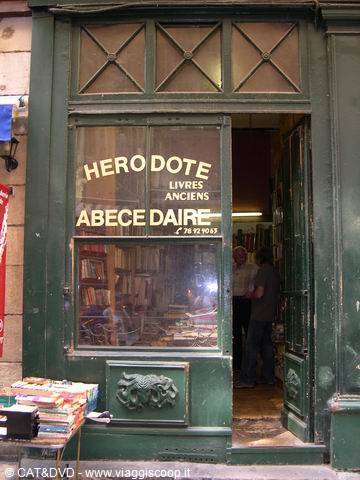 Herodote-Abecedaire used bookstore, green shopfront, books displayed on the sidewalk