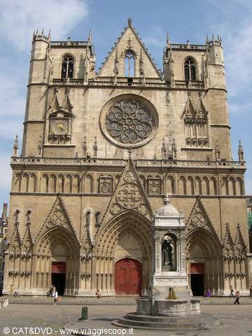 Gothic facade of Lyon Cathedral with rose window and fountain