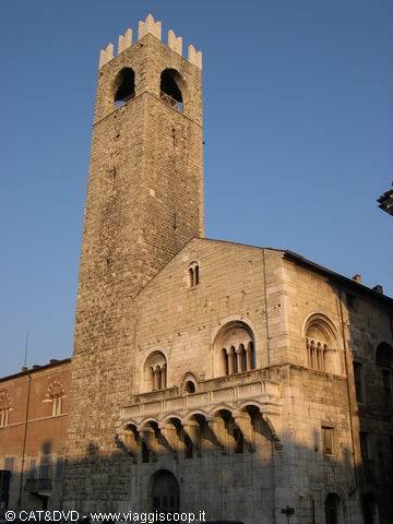 Stone crenellated tower and Romanesque palace in Brescia
